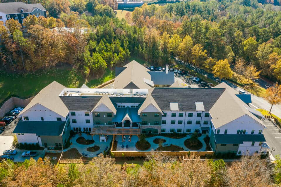 Aerial view of Longleaf community looking at side of community with fenced memory care patios in view