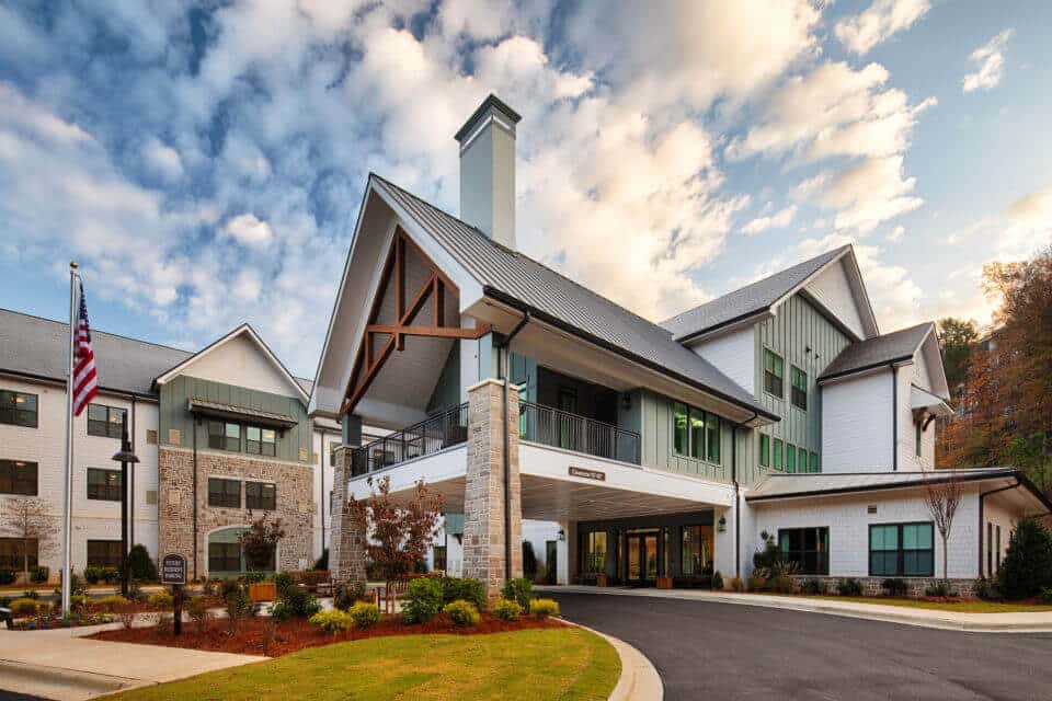 Exterior side front view of Longleaf Liberty Park entrance circle driveway with blue skies and white clouds