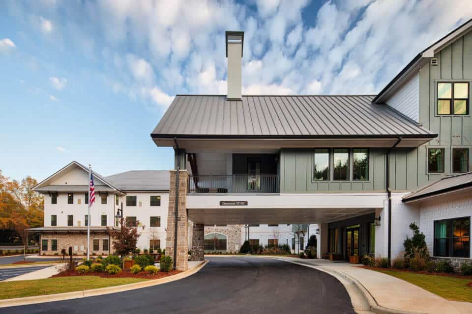 Exterior side front view of Longleaf Liberty Park entrance circle driveway with blue skies and white clouds