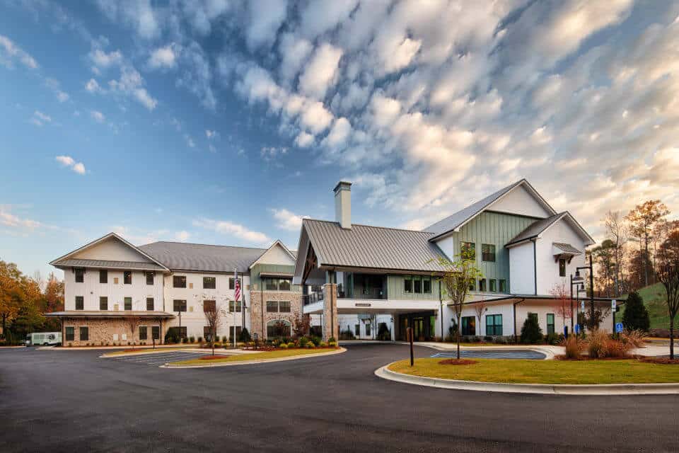 Exterior front view of Longleaf Liberty Park at sunset with blue skies and white clouds