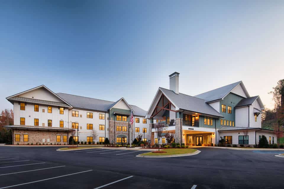 Front Exterior view of Longleaf Liberty Park with lights on at dusk